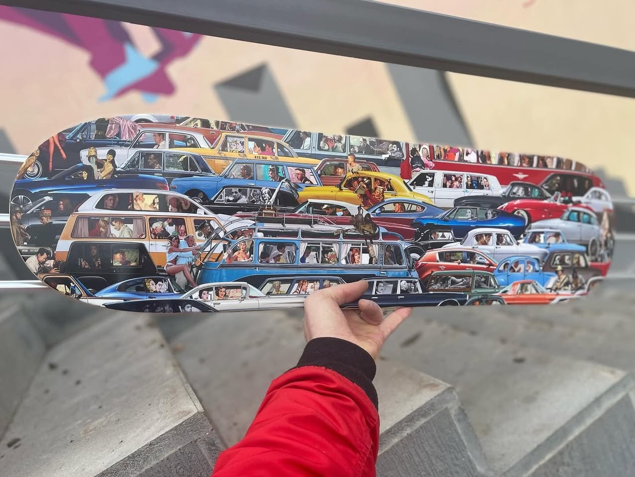 Traffic skateboard deck held in hand